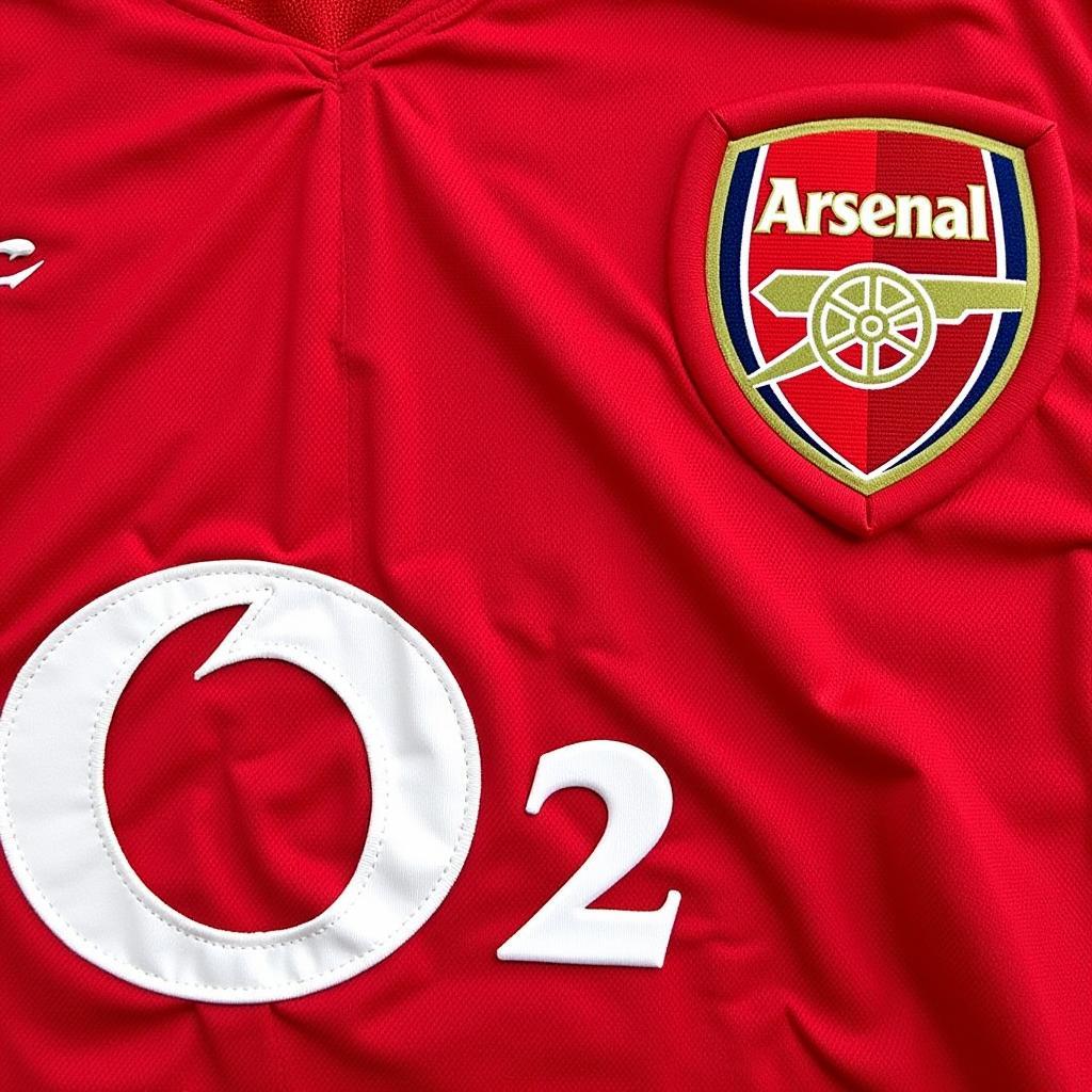 Close-up details of the 2004 Arsenal shirt, showcasing the fabric, stitching, and logos.