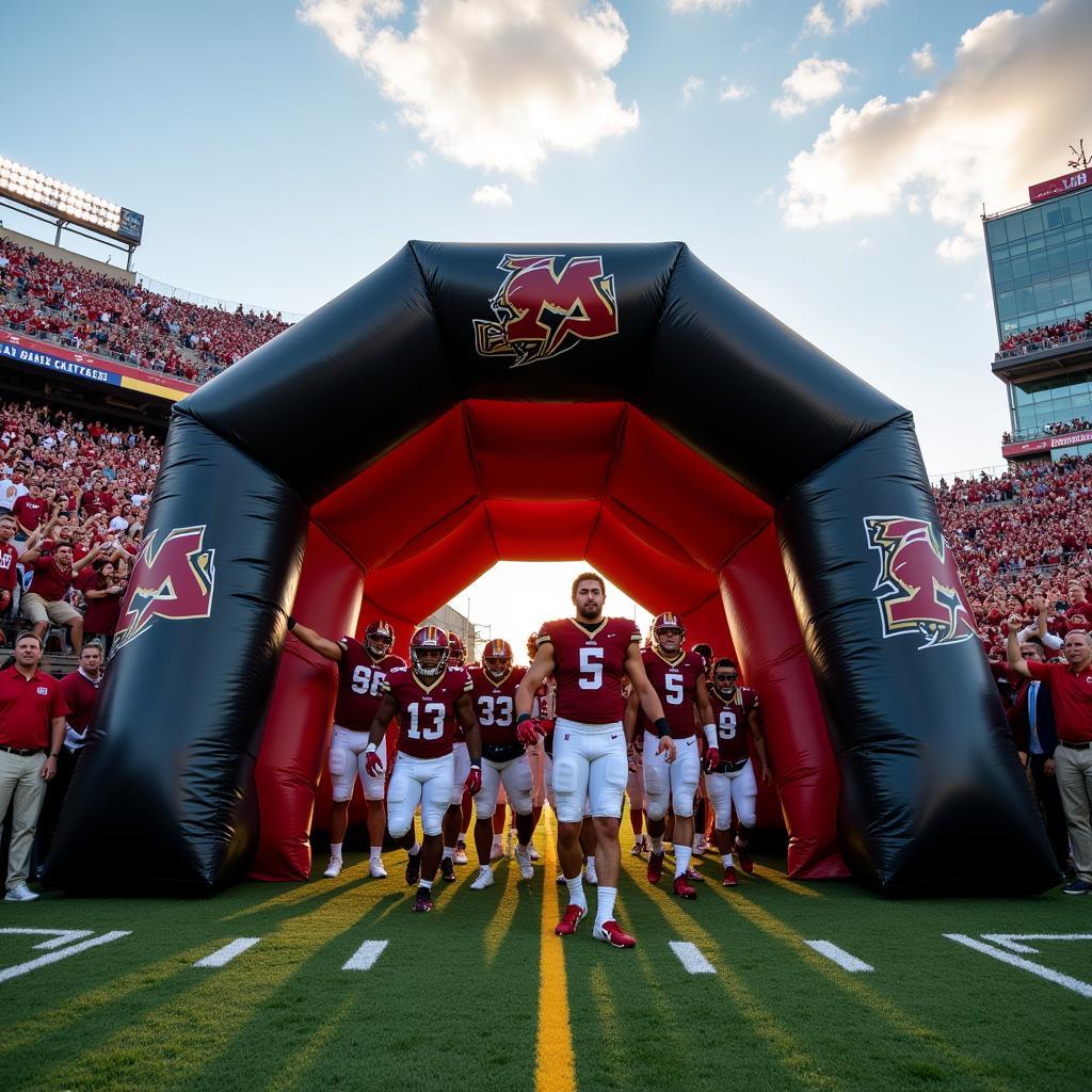 Football players emerging from an inflatable entrance tunnel.