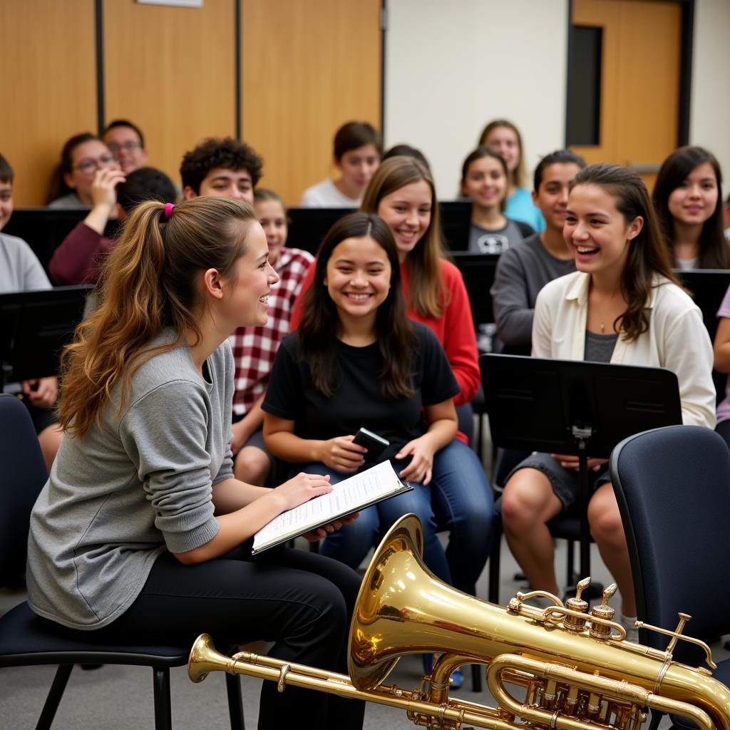 A band director laughing with their band students