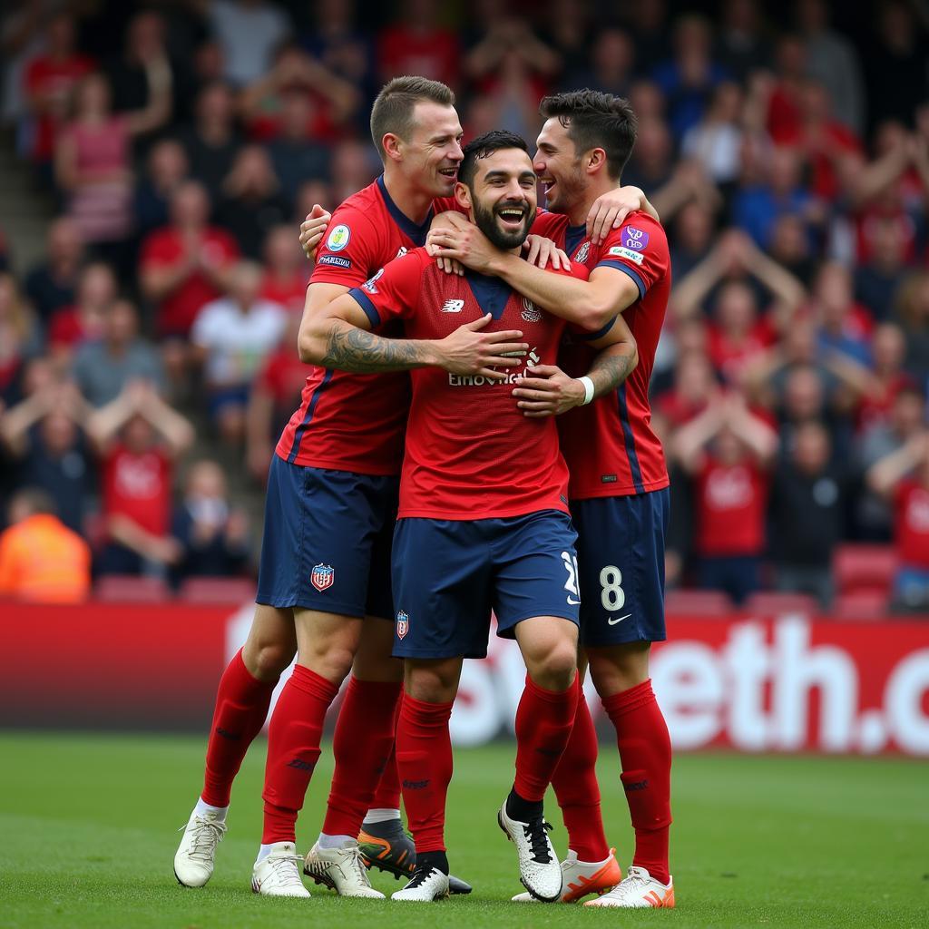 David Guest celebrating a goal with his teammates