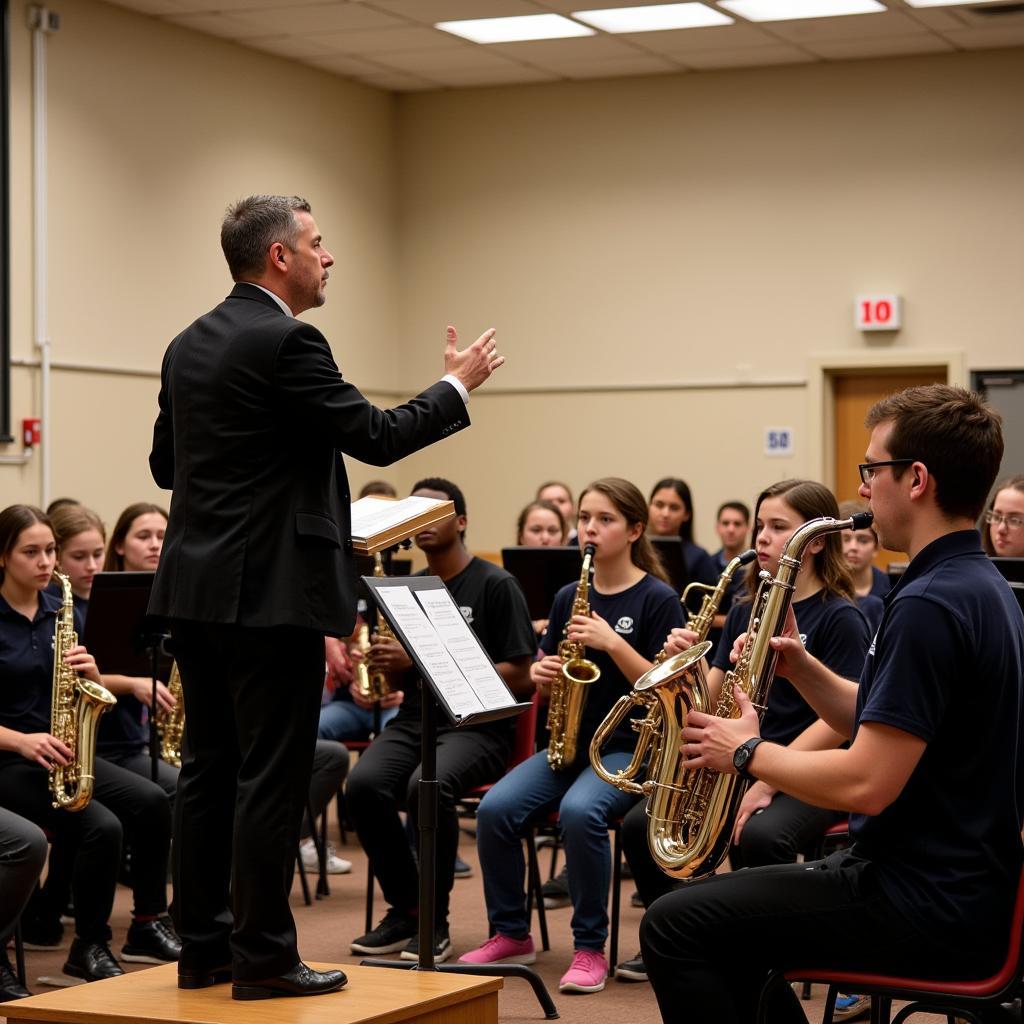 A band director conducting the band during a rehearsal