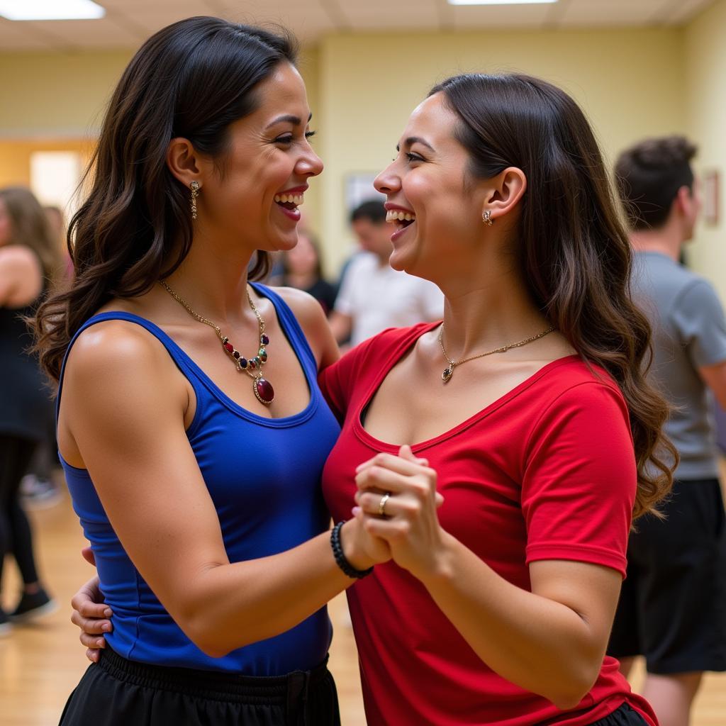 Salsa dancers sharing a laugh