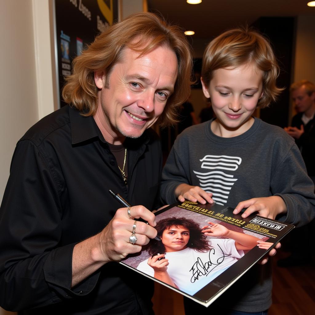 Eddie Money ký tên lên bìa album