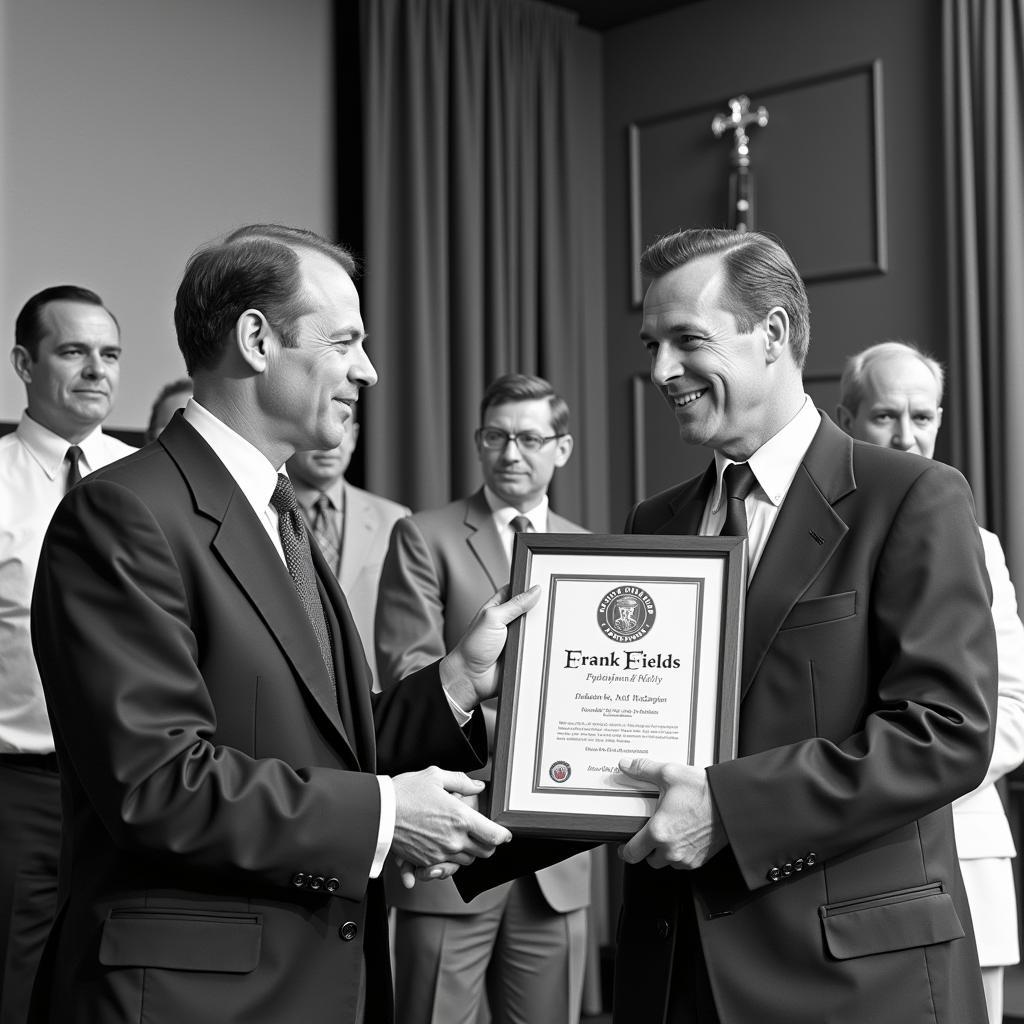 Frank Fields receiving an award