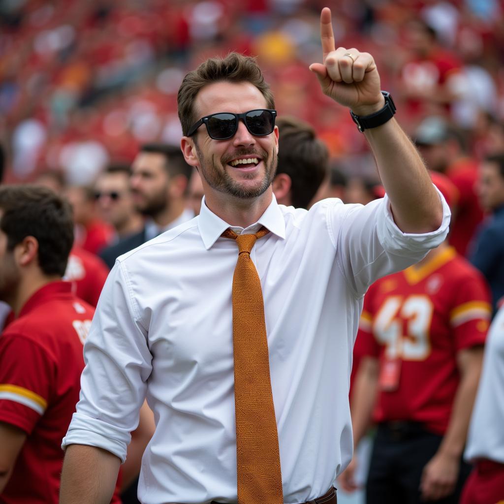 Man Wearing Gold and Brown Tie at Football Game